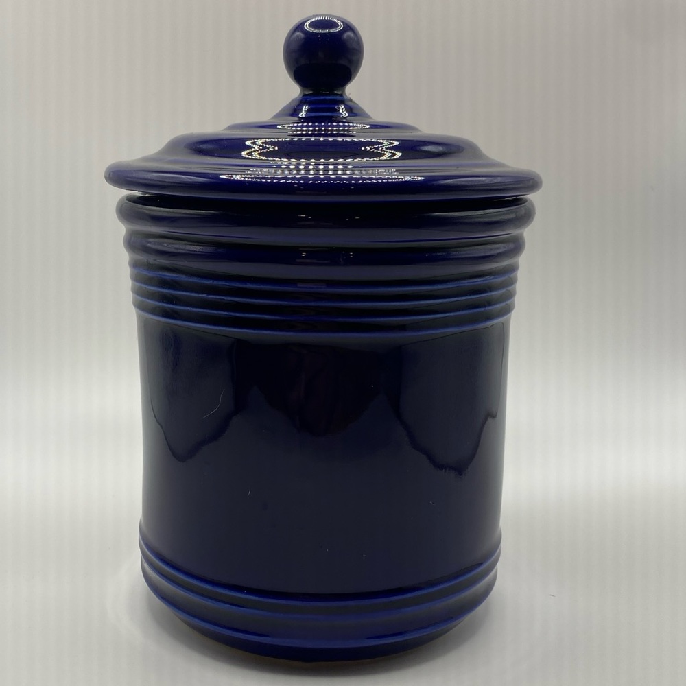 Midnight blue ceramic candy jar with lid.